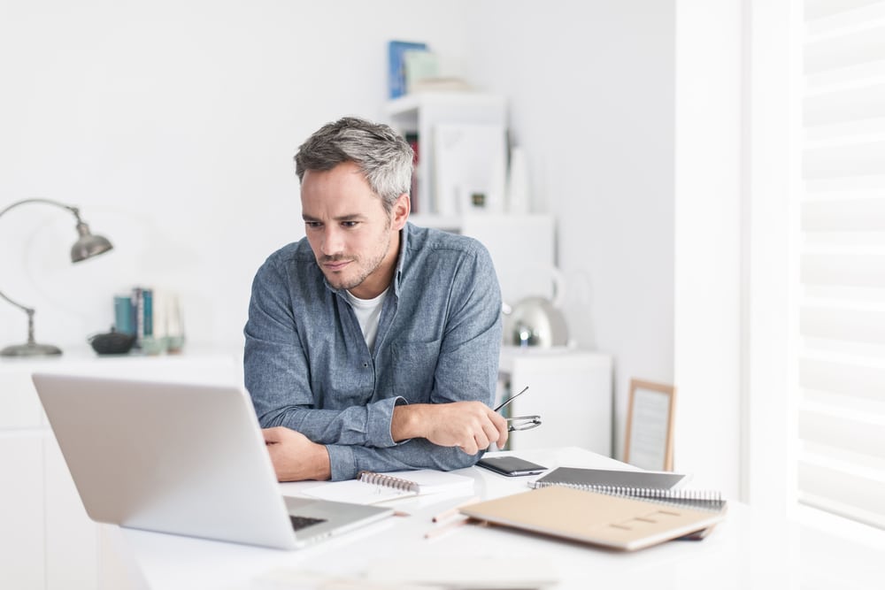 Man sat on laptop