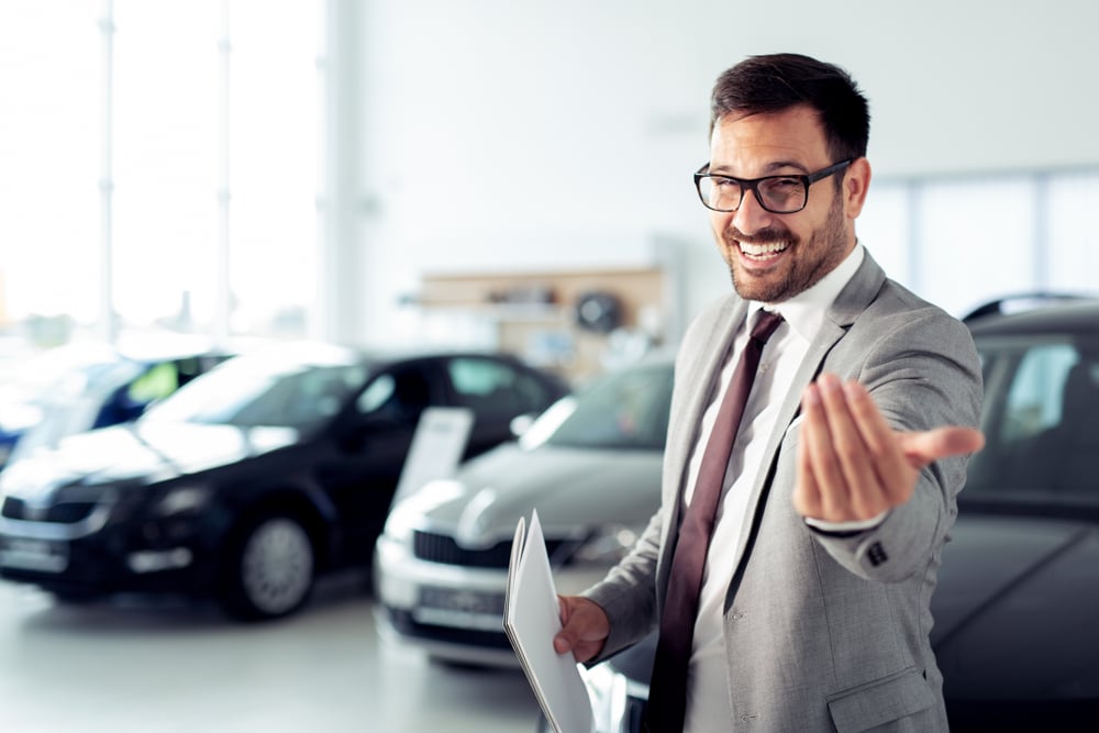 Car salesperson trying to sell desperately.