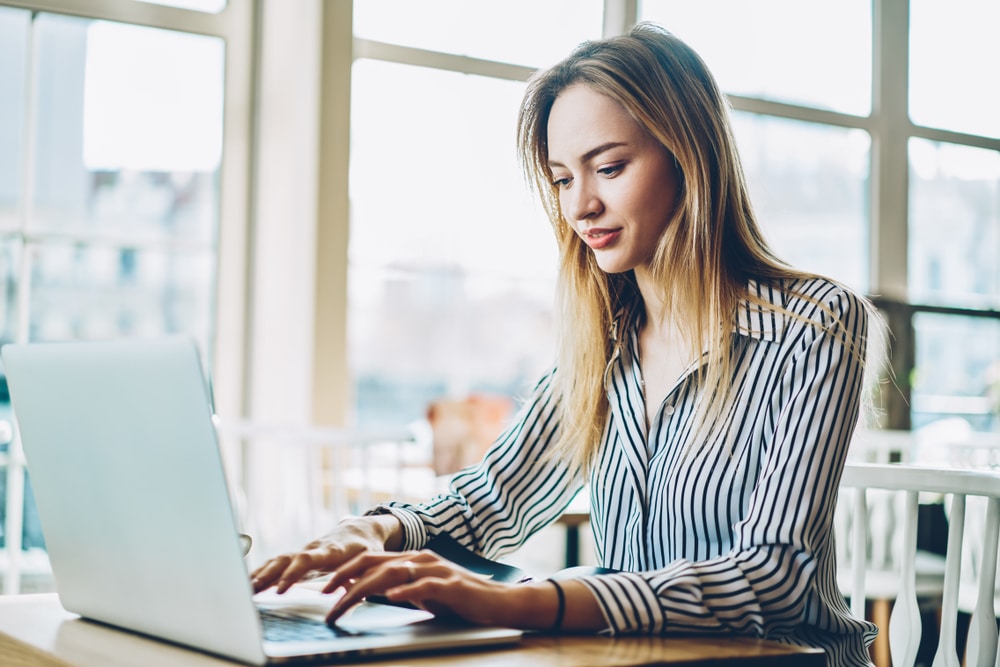 A female business owner updating her recruitment website.